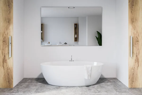 Modern bathroom interior with white walls, concrete floor, white bathtub with large mirror hanging above it. 3d rendering — Stock Image Modern Bathroom Interior White Walls Concrete Floor White Bathtub Large Stock Image