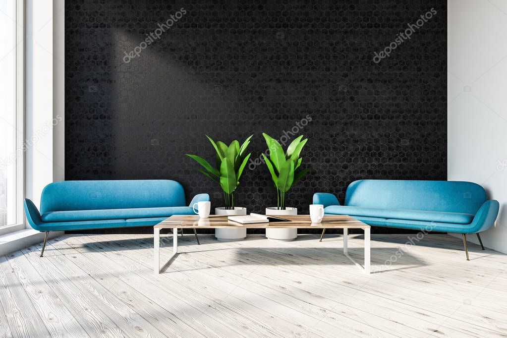 Stylish office lounge interior with black honeycomb pattern walls, wooden floor, two comfortable blue sofas and coffee table. 3d rendering mock up