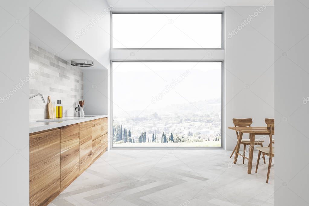 White kitchen and dining room interior with white walls, white wooden floor, wooden countertops and massive table with chairs. Window with mountain view. 3d rendering