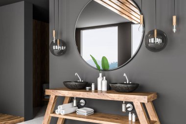 Çift banyo lavabo üzerinde ahşap tezgah üstünde gri duvar odasında asılı büyük yuvarlak ayna ile ayakta yan görünüm. 3D render
