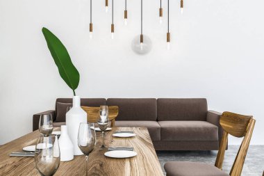 Beyaz duvarlar, beton zemin, uzun ahşap masa sandalye ve uzun bej kanepe ile şık yemek odası iç. 3D render
