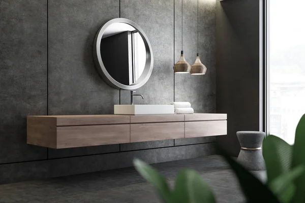 浴室コーナーではコンクリートの壁と床と白角シンク上に丸い鏡を木製のカウンターに立っています レンダリング — ストック写真