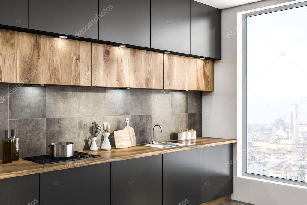 Side view of gray kitchen countertop with built in sink and wooden cupboards hanging above it. 3d rendering