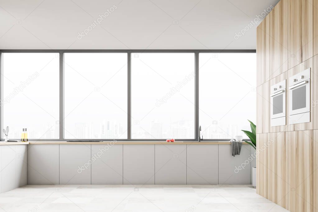 Panoramic kitchen interior with white countertops and wooden wall with built in ovens. Window with modern cityscape. 3d rendering
