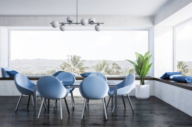 Beyaz duvarları, ahşap zemin, tropik manzaralı panoramik pencerelere ve mavi sandalye ile siyah tablo ile şık yemek odası iç. 3D render