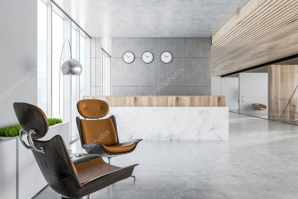 Modern office reception area with gray walls, marble reception desk, concrete floor and panoramic windows. Armchairs in the foreground. 3d rendering