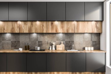 Önden Görünümü gri mutfak tezgah ile yapılı içinde lavabo ve ahşap dolaplar üstünde asılı. 3D render