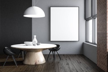 Gri ve siyah duvarlar, ahşap zemin ve yuvarlak masa etrafında duran siyah sandalye ile yemek odası iç. Dikey poster çerçeve sahte. 3D render.