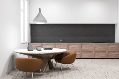 Modern mutfak beyaz duvarlar, ahşap zemin, gri ve ahşap mutfak tezgahı ve yakınında kahverengi koltuklar ile yuvarlak masa. 3D render