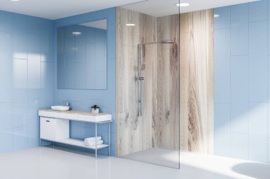 Mavi duvar, beyaz zemin, cam ve ahşap duş ve büyük kare ayna asılı üstündeki ile beyaz ve ahşap tezgah üzerinde duran beyaz lavabo banyo köşesinde. 3D render