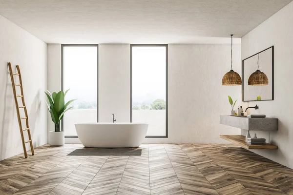 Modern bathroom interior with white walls, wooden floor, loft windows, white bathtub and marble double sink. 3d rendering
