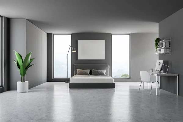 Interior of master bedroom with gray walls, concrete floor, master bed with poster hanging above it and home office with computer. 3d rendering mock up