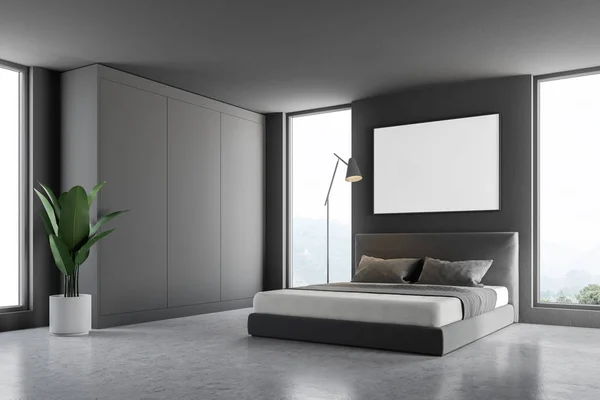 Corner of master bedroom with gray walls, concrete floor, master bed with poster hanging above it. 3d rendering mock up