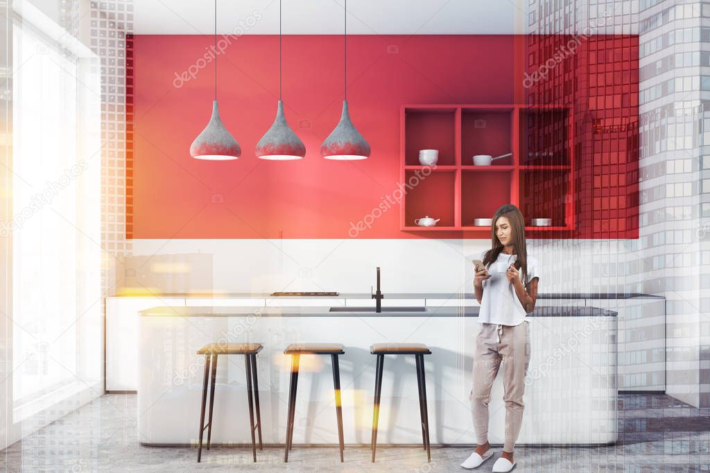 Woman in modern kitchen with red walls, concrete floor, shelves for dishes, white countertops with built in cooker and white bar with stools. Toned image double exposure