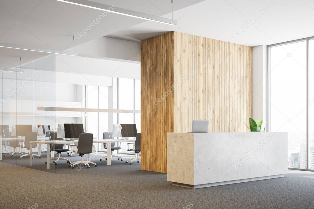 Side view of modern office with white and wooden walls, carpet on the floor, stone reception desk with two laptops and open space area in the background. 3d rendering