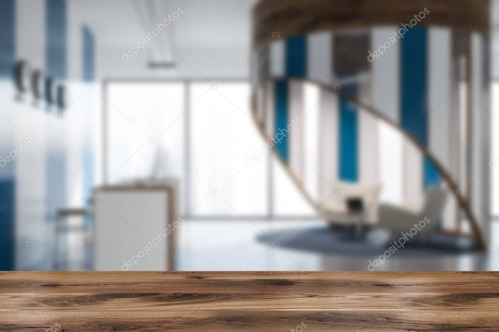 Side view of white and wooden reception desk with two computers on it standing in modern company office with white and blue walls and clocks with world time. Lounge area 3d rendering blurred