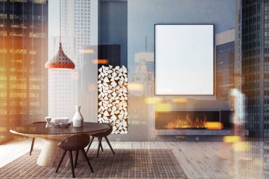 Modern yemek odası ile gri duvarlar, ahşap zemin, siyah sandalye ile yuvarlak masa ve bir şömine ile dikey posterinde kadında. Alay kadar bulanık tonlu görüntü çift pozlama