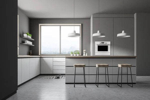 Interior of modern kitchen with gray walls, concrete floor, small window, white countertops with built in appliances, bar with stools and an oven. 3d rendering
