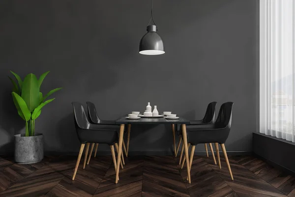 Interior of modern restaurant with dark gray walls, dark wooden floor and black and wooden tables standing near black and wooden chairs. 3d rendering
