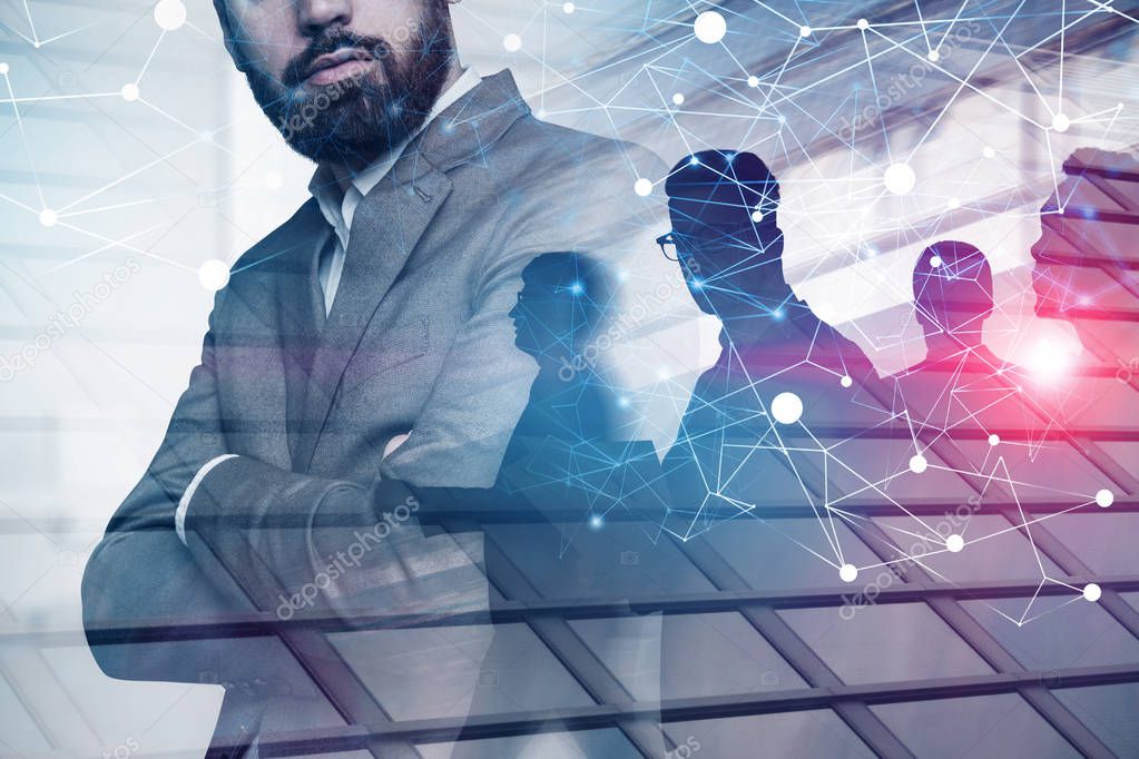 Confident business leader standing with crossed arms with his business team in the background with double exposure of network hologram. Toned image