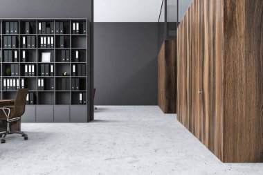 Gri duvarlar, beton zemin, ahşap masa sandalye ve klasörlerle kitaplık modern ofis iç. Ahşap Ofis kapı sağ. 3D render
