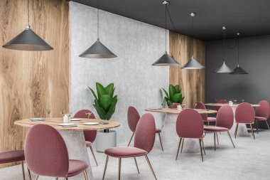 Gri, ahşap ve beton duvarlar, beton zemin ve onlara yakın duran kırmızı sandalye ile yuvarlak ahşap tabloları satırları ile modern kafe köşesinde. 3D render