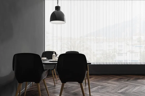 Interior of modern restaurant with dark gray walls, dark wooden floor and black and wooden tables standing near black and wooden chairs. Panoramic window. 3d rendering
