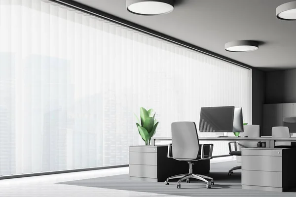 Workplace in panoramic office with dark gray walls, concrete floor, gray computer table and gray chair. 3d rendering