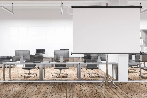 Horizontal poster standing in office lobby with white walls, wooden floor and rows of gray computer tables seen through glass wall. 3d rendering mock up