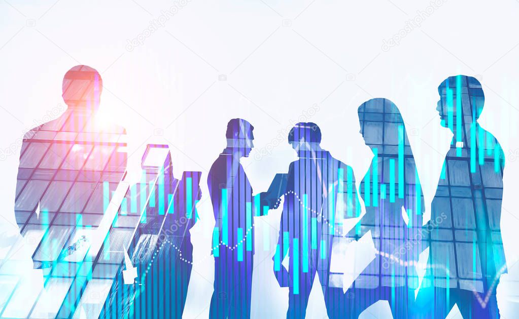 Silhouettes of diverse business team members over white background with double exposure of skyscraper and graph. Stock market concept. Toned image