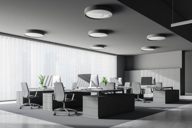Modern ofis Gri duvarlar, taş zemine, panoramik pencere ve gri sandalye ile gri bilgisayar tabloları satırları köşesinde. 3D render