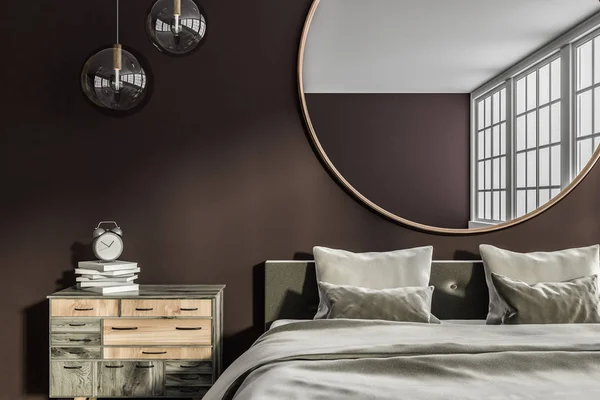 Interior of master bedroom with brown and white walls, big window, gray master bed with bedside table and round mirror hanging above it. 3d rendering