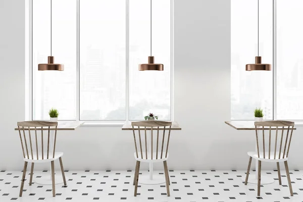 Interior of loft cafe with white walls, tiled floor, square wooden tables and white and wooden chairs standing near them. 3d rendering