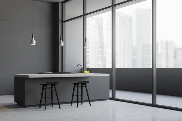 Minimalistic gray kitchen interior with gray walls, concrete floor, loft windows and gray bar with stools next to countertops with sink. Balcony in the background. 3d rendering
