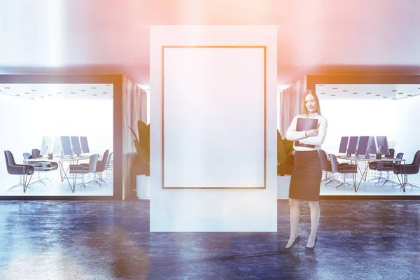 Two wooden and white offices with wooden tables and black chairs standing in panoramic room with concrete floor. Businessoman near poster. Toned image mock up