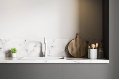 Beyaz duvar odadaki gri tezgah üzerinde duran beyaz mermer evye. Ahşap yuvarlak kesme tahtası ve küçük bitki saksı. 3D render