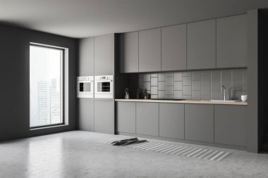 Gri duvarlar, beton zemin, çatı penceresi ile şık mutfak ve gri ve ahşap mutfak tezgahı köşesinde. İki fırın. 3D render