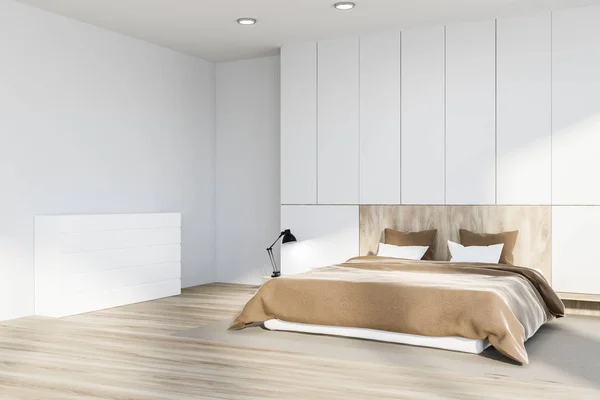 Corner of master bedroom with white walls, wooden floor with a carpet, white and wooden master bed and white closet. 3d rendering