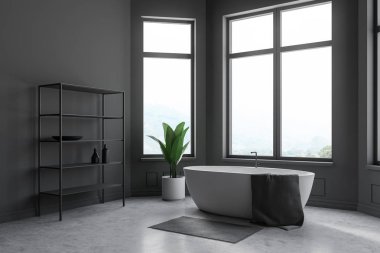 Bu gri raflar yanında duran köşede gri beton zemin, geniş pencereler ve havlu ile beyaz küvet ile banyo. 3D render