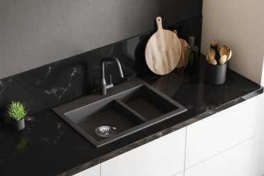 Üstten görünüm siyah mermer mutfak lavabo beyaz countertop siyah duvarlı odada tutuyoruz. Ahşap yuvarlak kesme tahtası ve küçük bitki saksı. 3D render