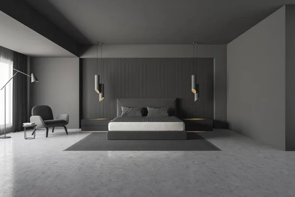 Interior of master bedroom with gray walls, concrete floor, gray bed standing on carpet and gray armchair. 3d rendering