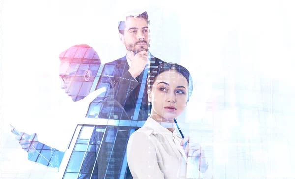 African American businessman with smartphone, pensive businesswoman and thoughtful businessman over skyscraper background. Toned image double exposure