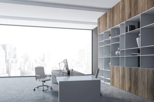 Interior of panoramic manager office with gray walls, concrete floor, white and wooden computer table with white chairs and bookcase with vases. 3d rendering