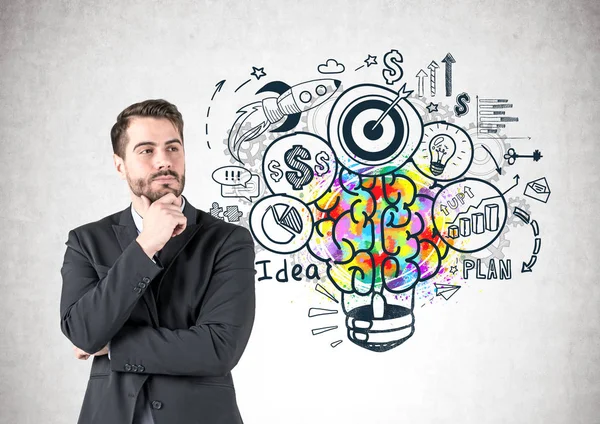 Renkli iş fikir kroki ile beton duvarının yakınında duran koyu takım elbise giymiş sakallı dalgın Genç beyaz işadamı portresi