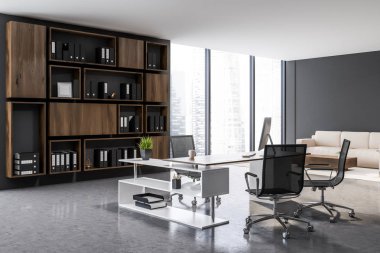 Ceo office Gri duvarlar, beton zemin, beyaz ve ahşap bilgisayar masa ve koyu ahşap raflar ile ağıl iç. Sehpa yakınındaki bej kanepe. 3D render