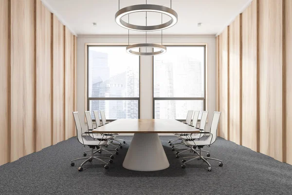 Interior of office meeting room with wooden walls, carpeted floor, two large windows and long wooden table with white chairs. 3d rendering