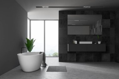 Siyah taş duvarlar, beton zemin, geniş pencere, bu havluda ile gri tezgah ve beyaz küvet ayakta beyaz lavabo banyo iç. 3D render