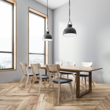 Corner of dining room with gray walls, wooden floor, wooden table with gray and wooden chairs and two ceiling lamps. 3d rendering