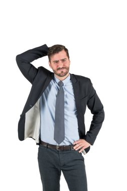 Isolated portrait of confused thinking bearded businessman scratching his head. Concept of decision making clipart