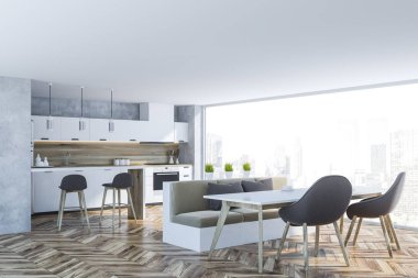 Interior of panoramic kitchen with concrete walls, wooden floor, white countertops, white and wooden bar and table with beige sofa and gray chairs. 3d rendering